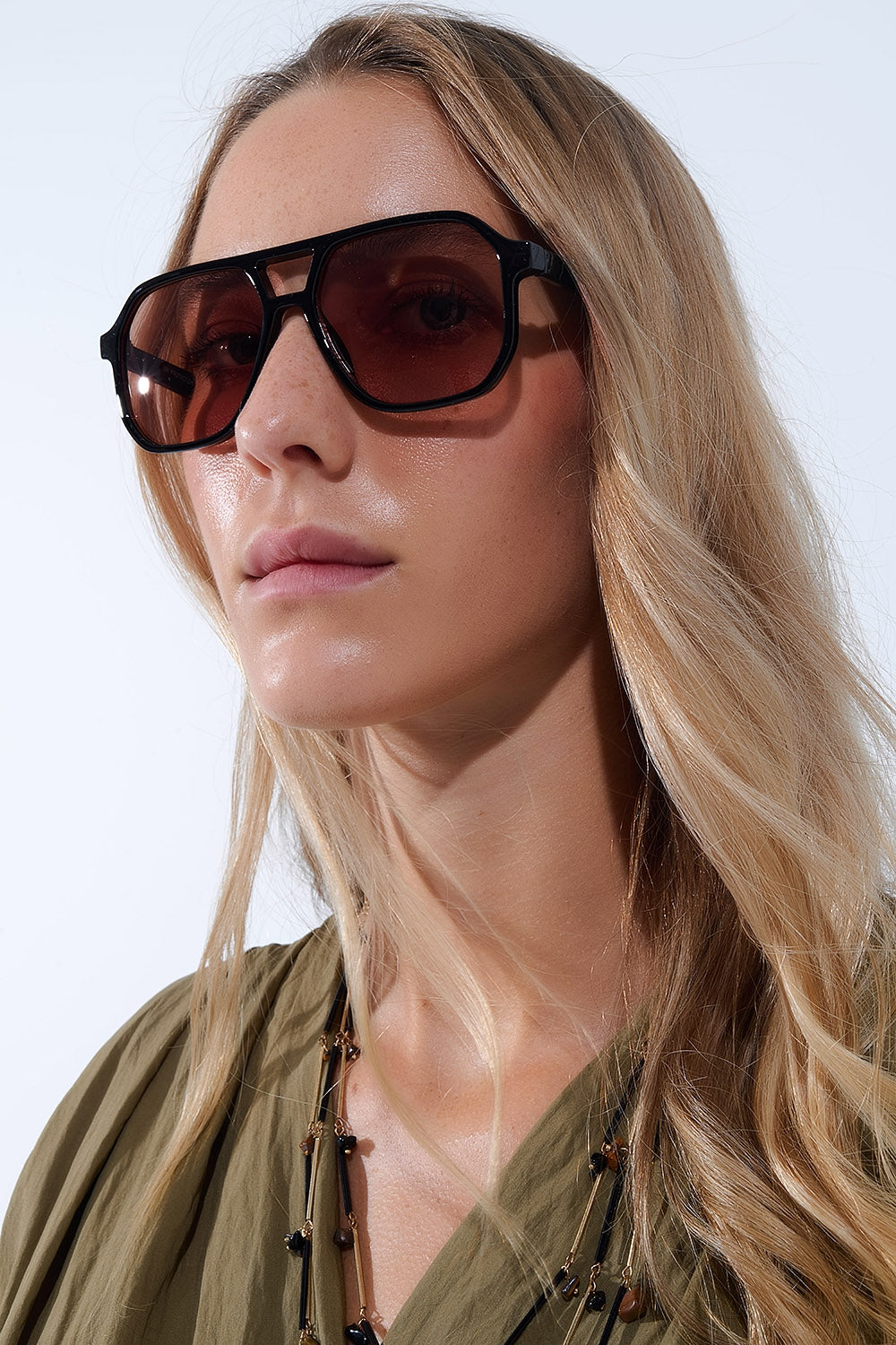 Retro style Sunglasses with black frames and orange lenses