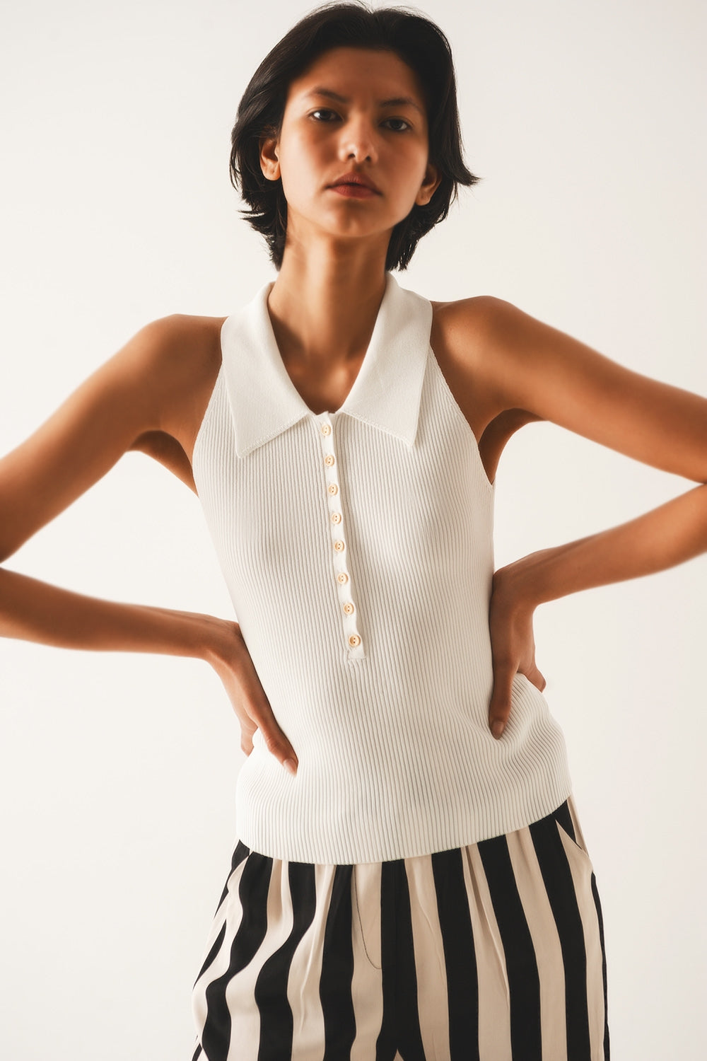 Ribbed knitted top with polo neck in cream