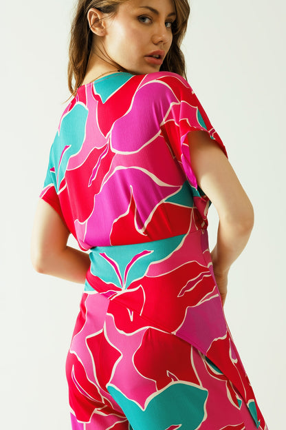 Satin Short sleeves top with floral design and a knot detail