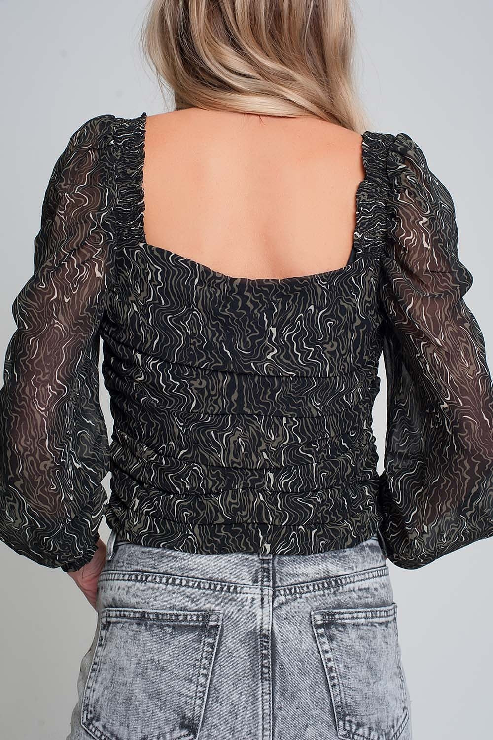 See-through top with long sleeves geo print in black color with elastic cuffs
