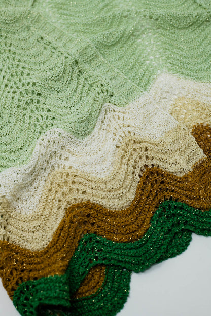 Short knitted cardigan with angel sleeves and wave multicolor detail in green