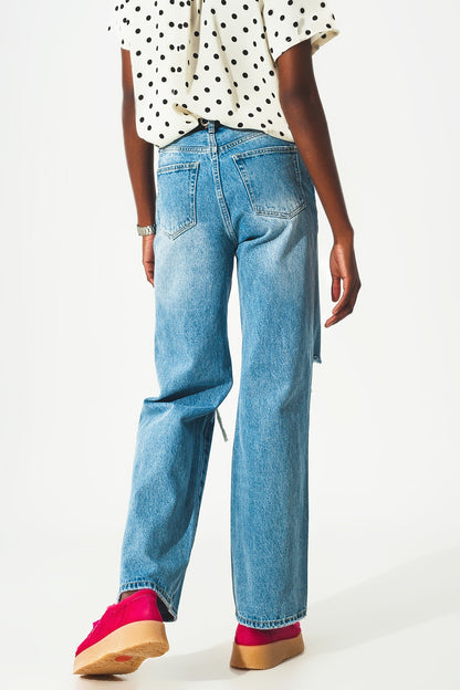 Straight jean in medium wash with rip and split hem