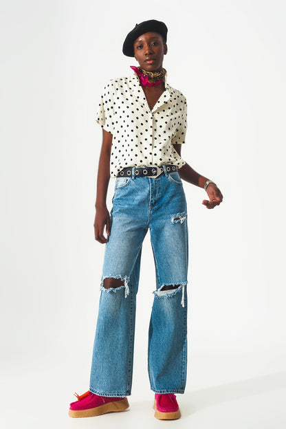 Straight jean in medium wash with rip and split hem