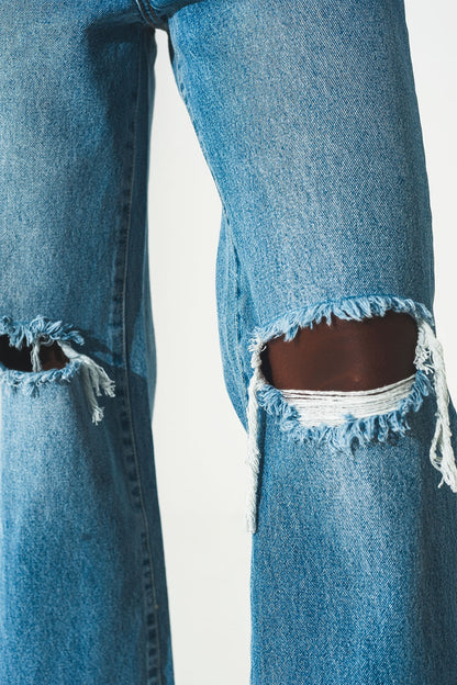 Straight jean in medium wash with rip and split hem