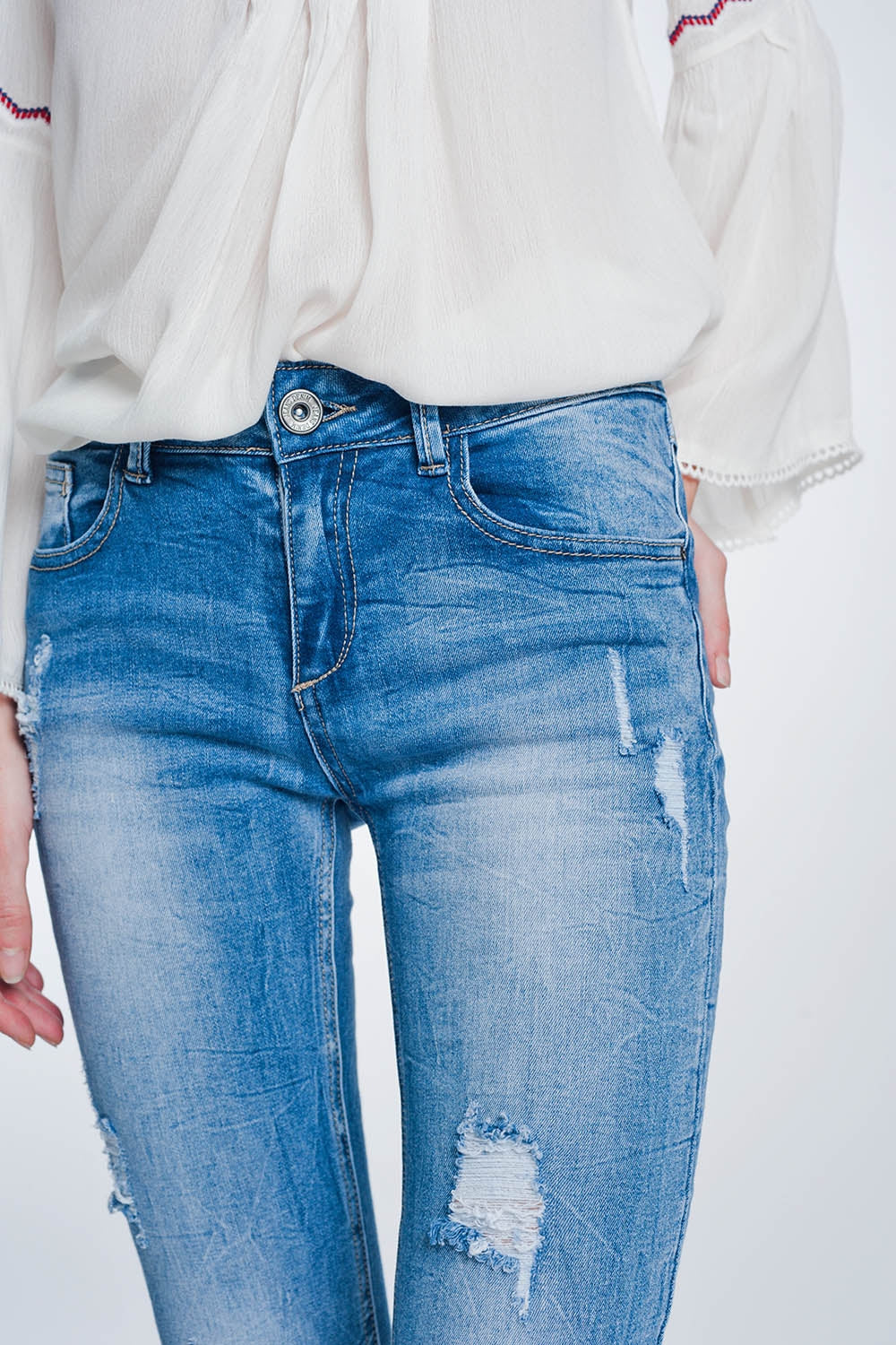 super skinny jeans in vintage mid wash blue with heavy rips