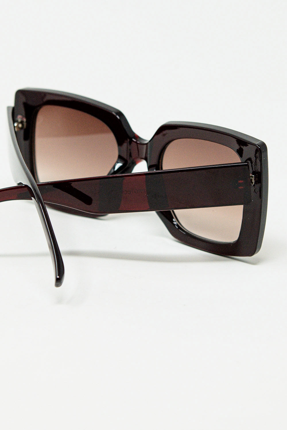 vintage silhouette sunglasses with a subtle angled cat-eye in burgundy