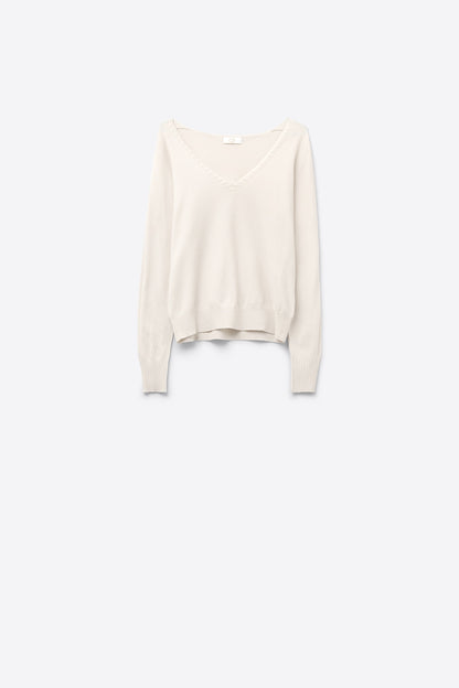 Q2 White  sweater with V neckline