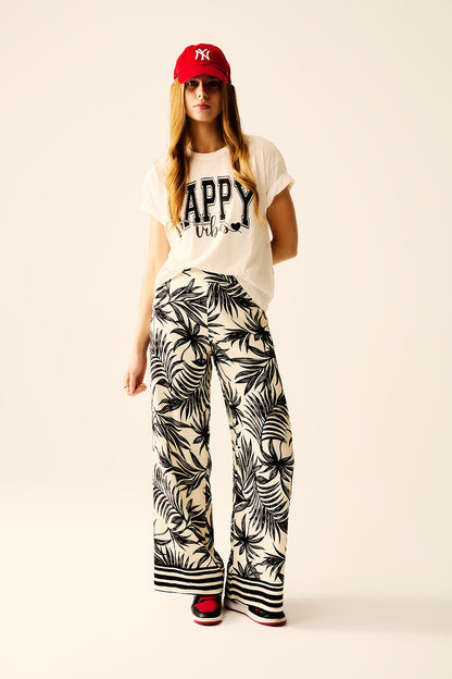 Wide Leg Pants In White With Floral Detail In Black