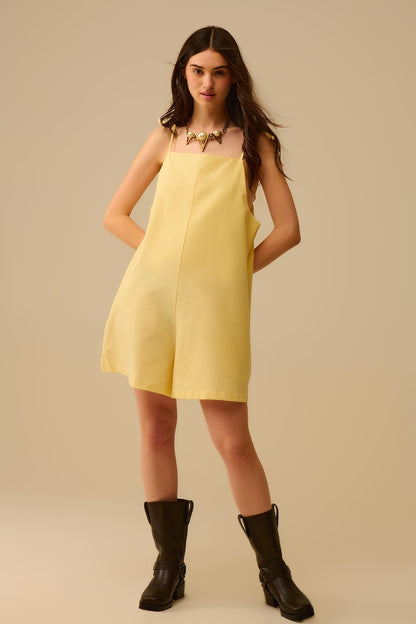Yellow striped playsuit with shoulder ties and back pocket detail